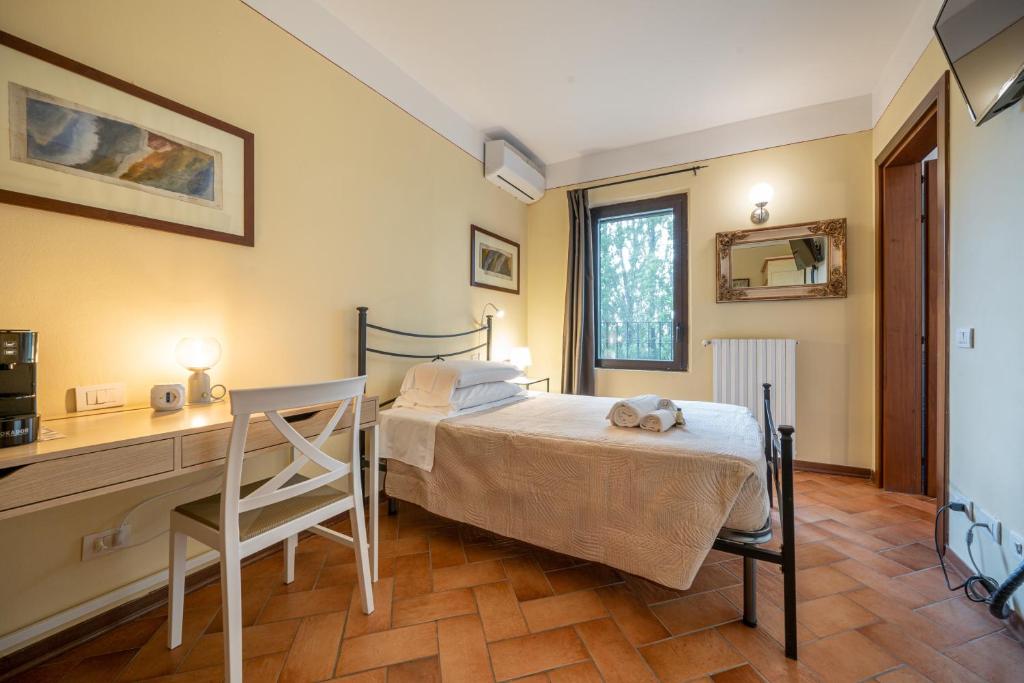 Postel nebo postele na pokoji v ubytování Casello A1, Modena sud - Villa Aurora Charming Rooms