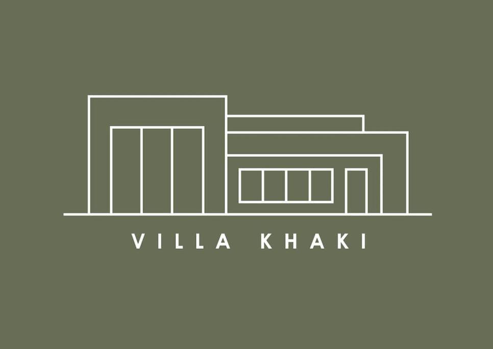 a logo for a company with a building at Villa Khaki 