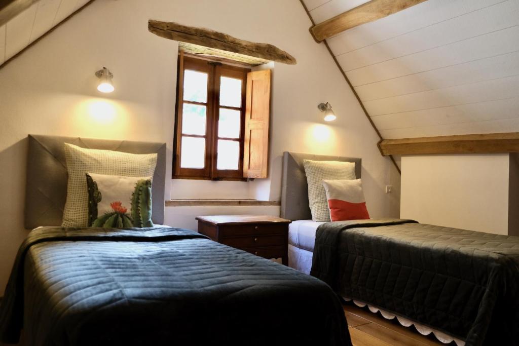 Postel nebo postele na pokoji v ubytování Manoir de l'Isle