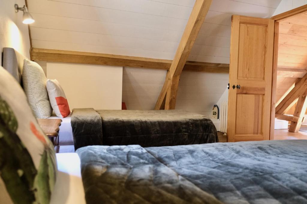 Postel nebo postele na pokoji v ubytování Manoir de l'Isle