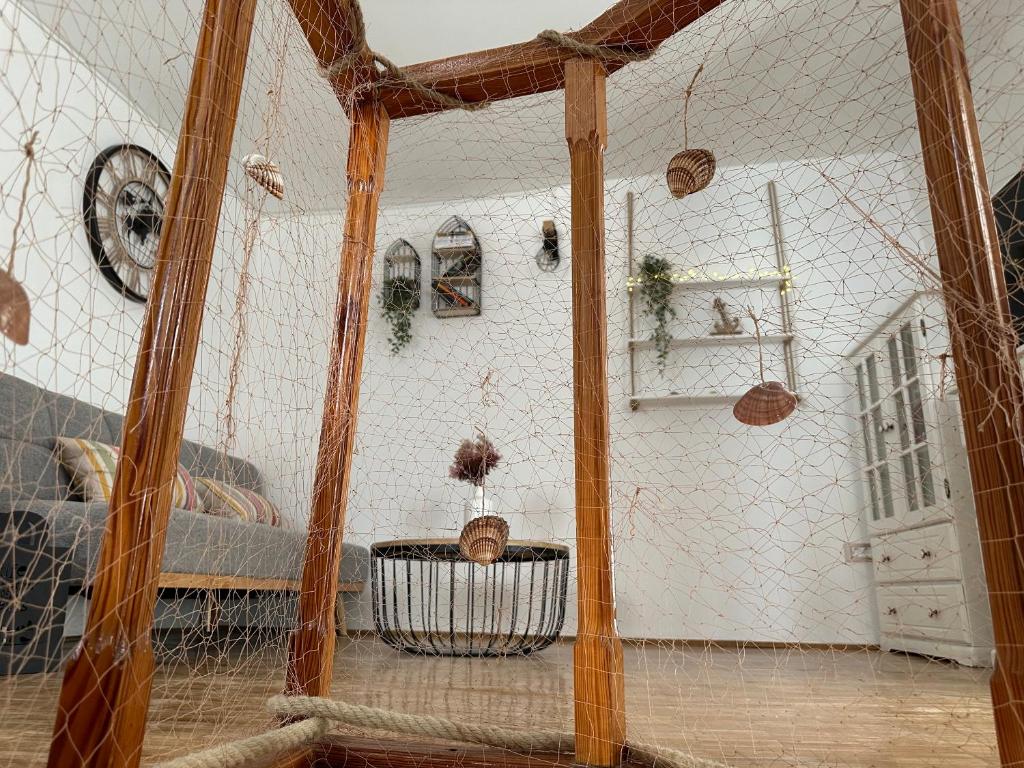 a living room with a cage in the middle of a room at Carpe diem Baška in Baška