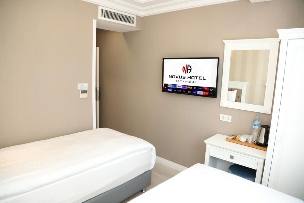 Postel nebo postele na pokoji v ubytování Novus Hotel İstanbul