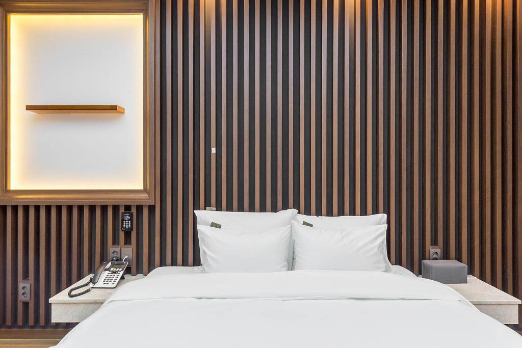 Postel nebo postele na pokoji v ubytování Hotel Demer Mokpo