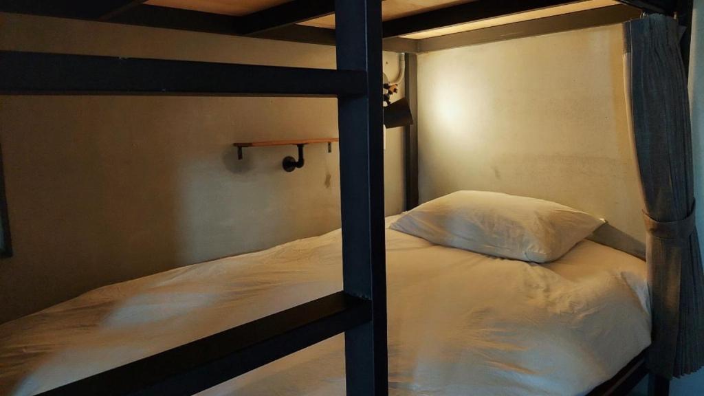 Postel nebo postele na pokoji v ubytování 以安二館