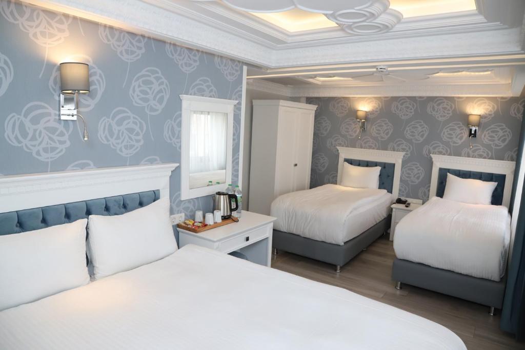 Postel nebo postele na pokoji v ubytování Novus Hotel İstanbul