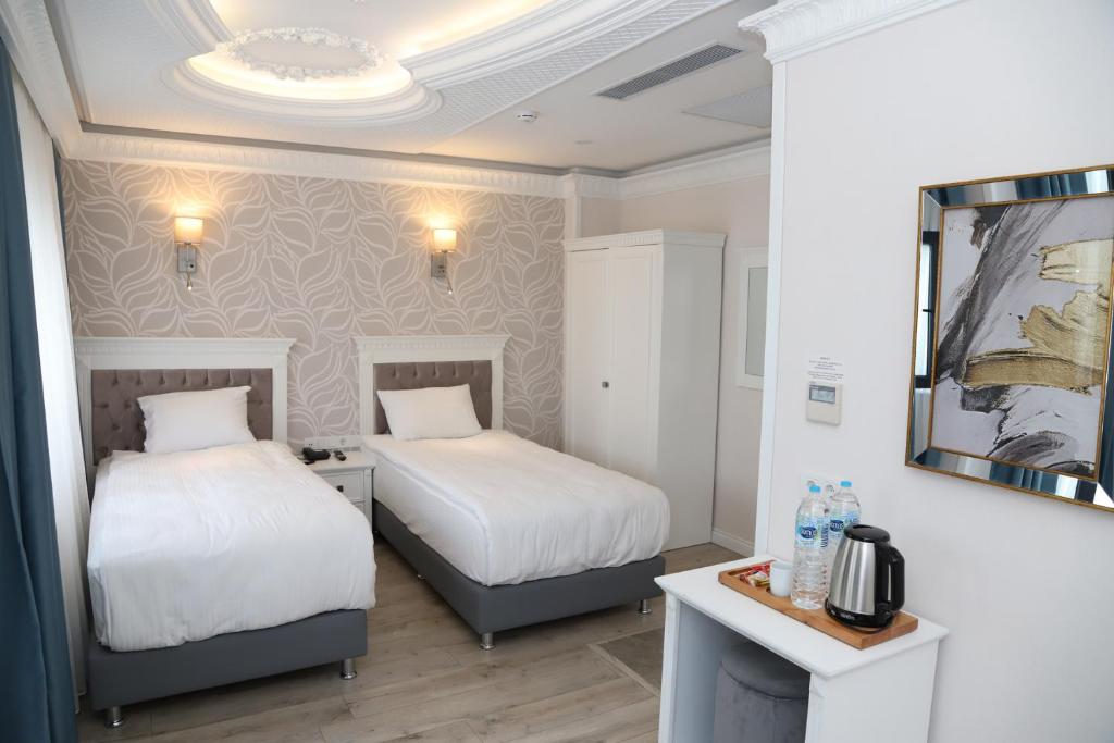 Postel nebo postele na pokoji v ubytování Novus Hotel İstanbul