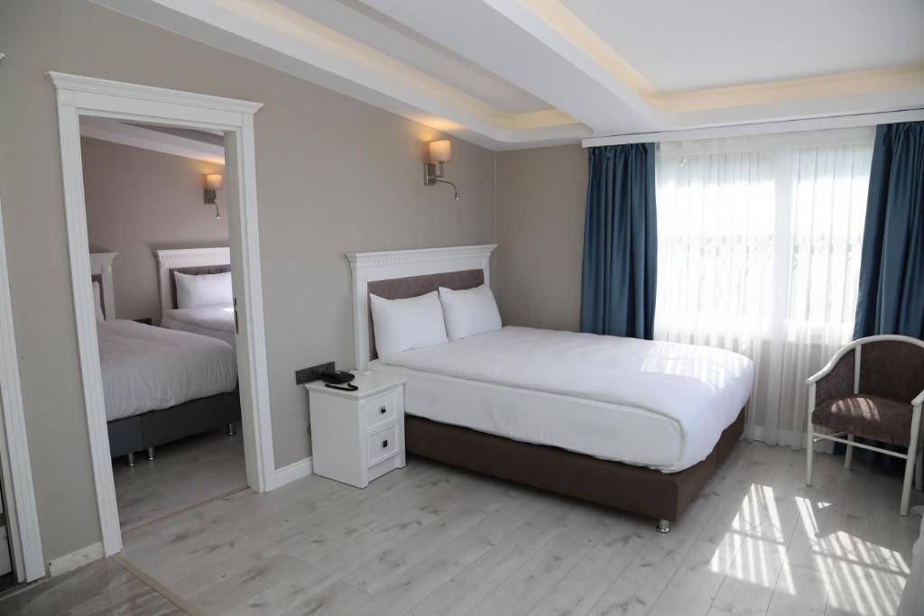 Postel nebo postele na pokoji v ubytování Novus Hotel İstanbul