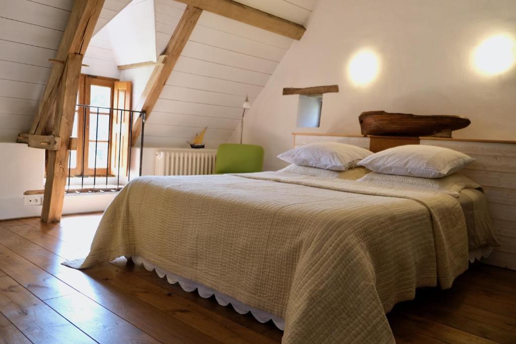 Postel nebo postele na pokoji v ubytování Manoir de l'Isle