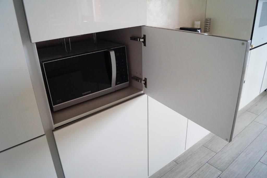 Kuchyň nebo kuchyňský kout v ubytování Charme Lake Loft