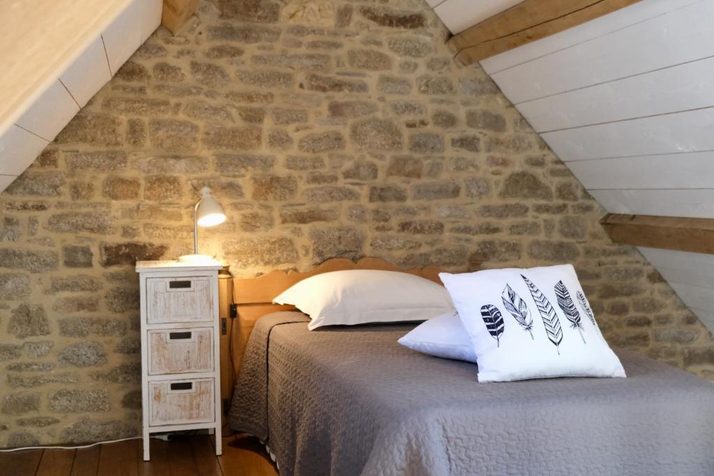 Postel nebo postele na pokoji v ubytování Manoir de l'Isle