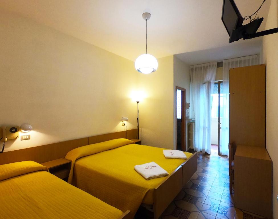 Postel nebo postele na pokoji v ubytování Hotel Milton