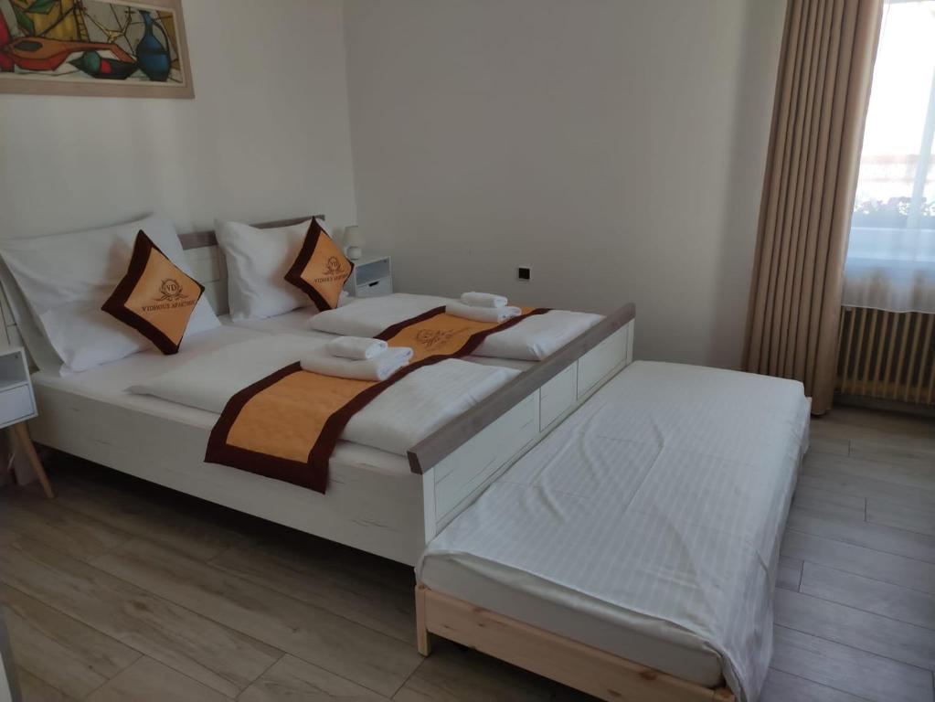 Postel nebo postele na pokoji v ubytování Pension VIDHOUS 1
