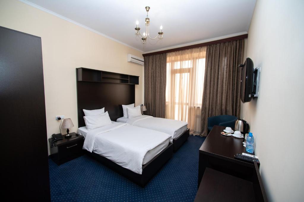 Postel nebo postele na pokoji v ubytování 14 Floor Hotel