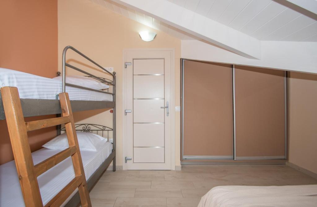 Postel nebo postele na pokoji v ubytování Gold Olive Suites by "elite"