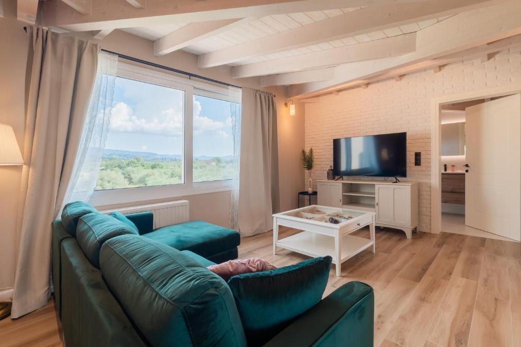 TV a/nebo společenská místnost v ubytování Melena Premium Suites