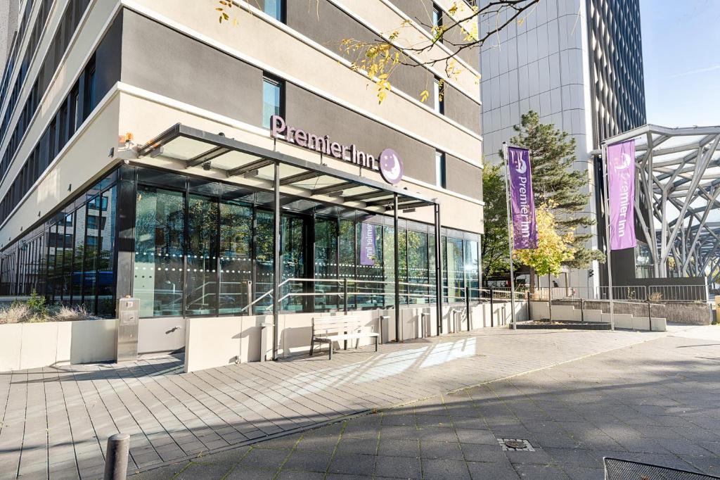 a building with a sign on the front of it at Premier Inn Frankfurt Westend in Frankfurt