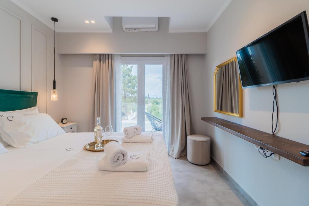 Postel nebo postele na pokoji v ubytování Melena Premium Suites
