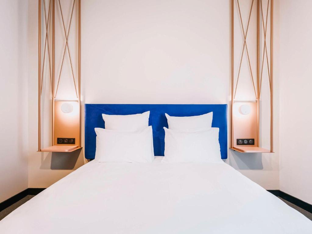 Postel nebo postele na pokoji v ubytování Mercure Brest Centre Port