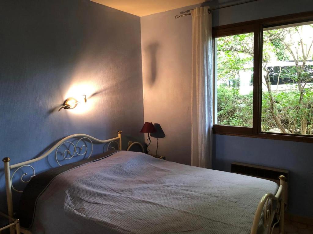 Postel nebo postele na pokoji v ubytování Hôtel Les Persèdes
