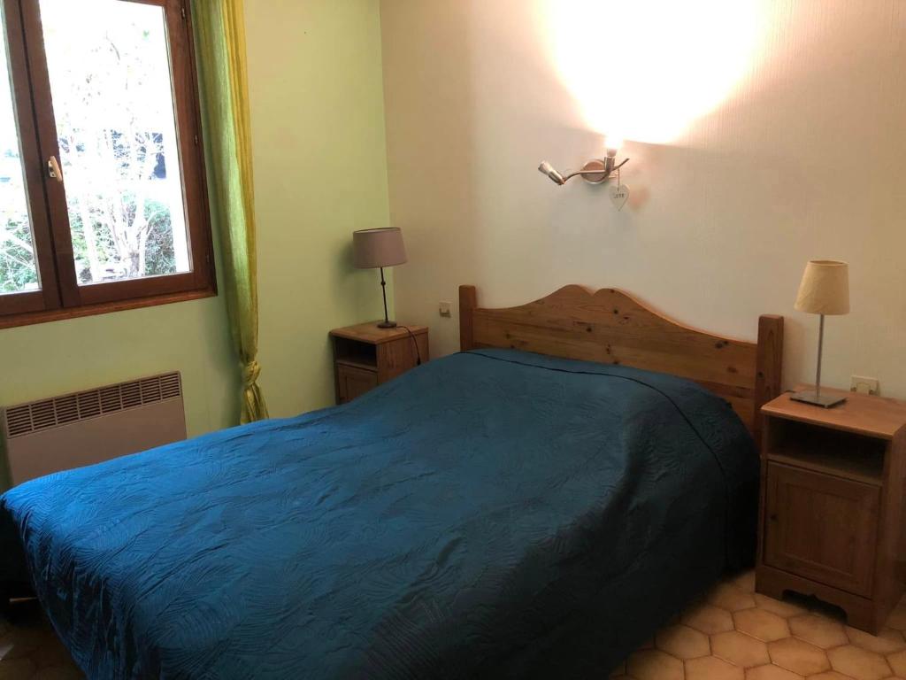 Postel nebo postele na pokoji v ubytování Hôtel Les Persèdes