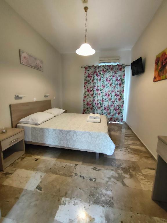 Posteľ alebo postele v izbe v ubytovaní Dionisos Apts Gouvia by Estia