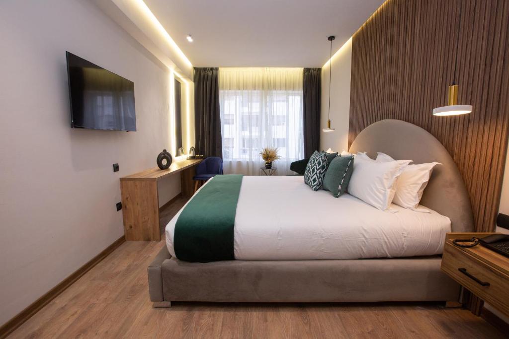 TV a/nebo společenská místnost v ubytování Le M Hôtel