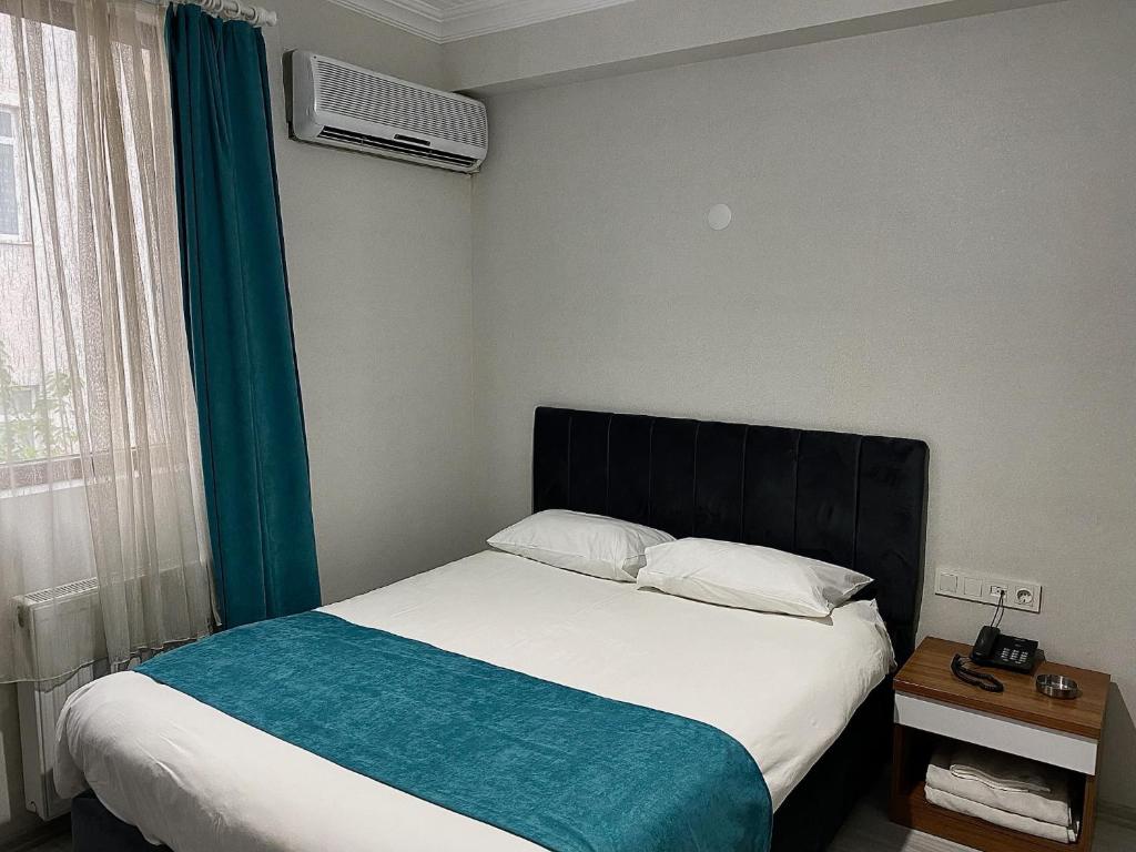 Postel nebo postele na pokoji v ubytování Elite Holiday Hotel