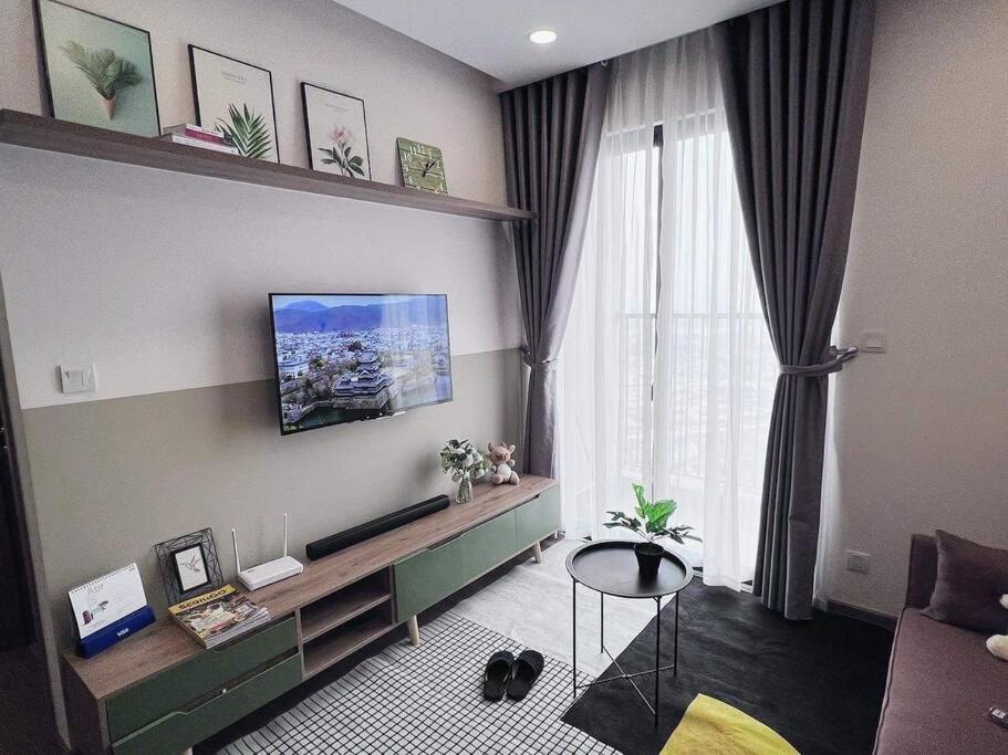 A television and/or entertainment centre at BIG PROMO!River view apartment