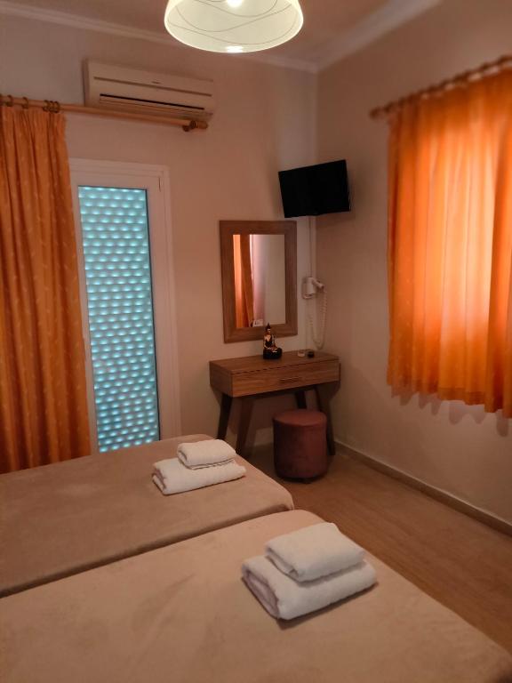 Posteľ alebo postele v izbe v ubytovaní Dionisos Apts Gouvia by Estia