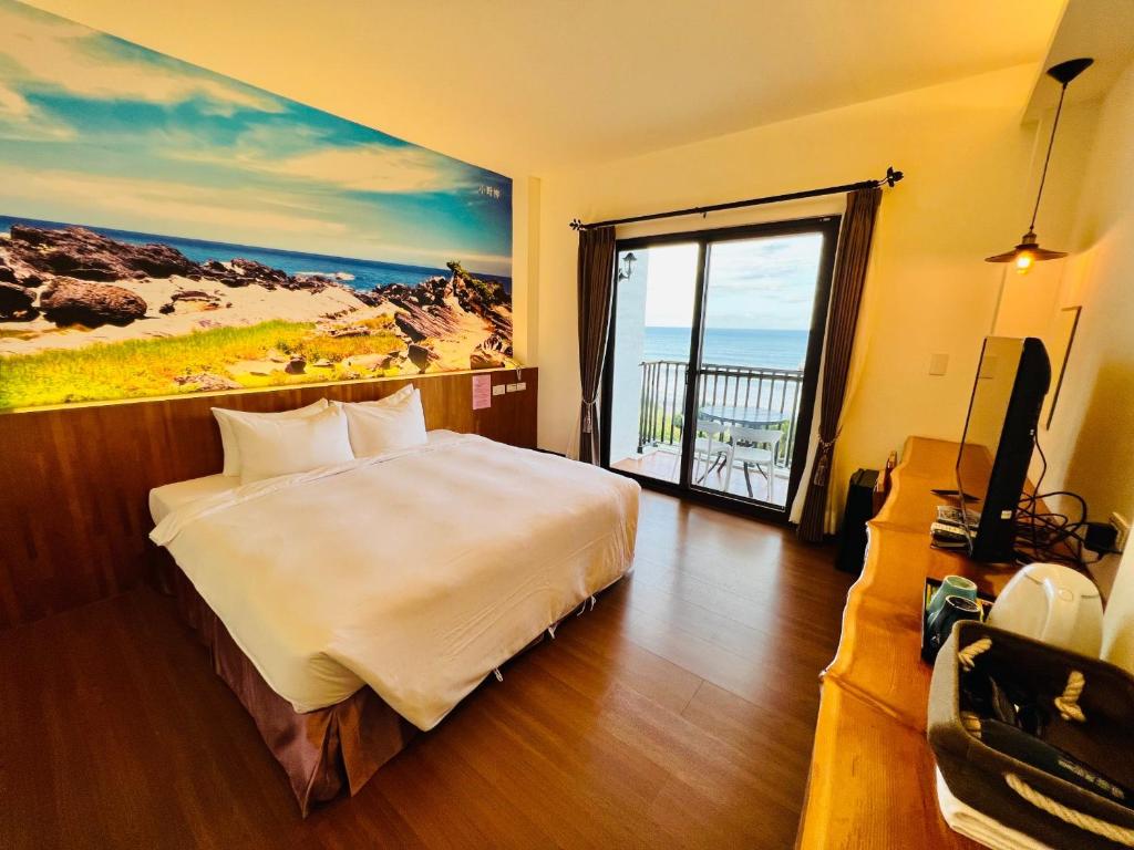 Rúm í herbergi á Taitung Blue Sea Villa