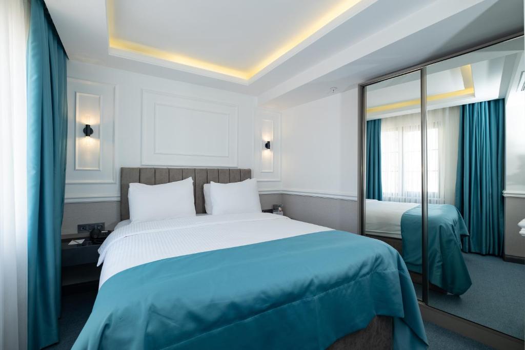 Postel nebo postele na pokoji v ubytování Askadar May Otel
