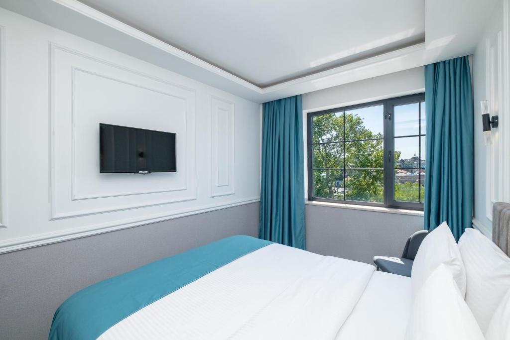 Postel nebo postele na pokoji v ubytování Askadar May Otel