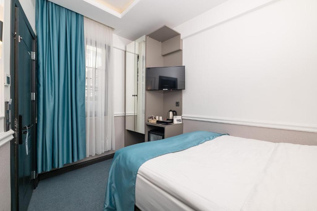 Postel nebo postele na pokoji v ubytování Askadar May Otel