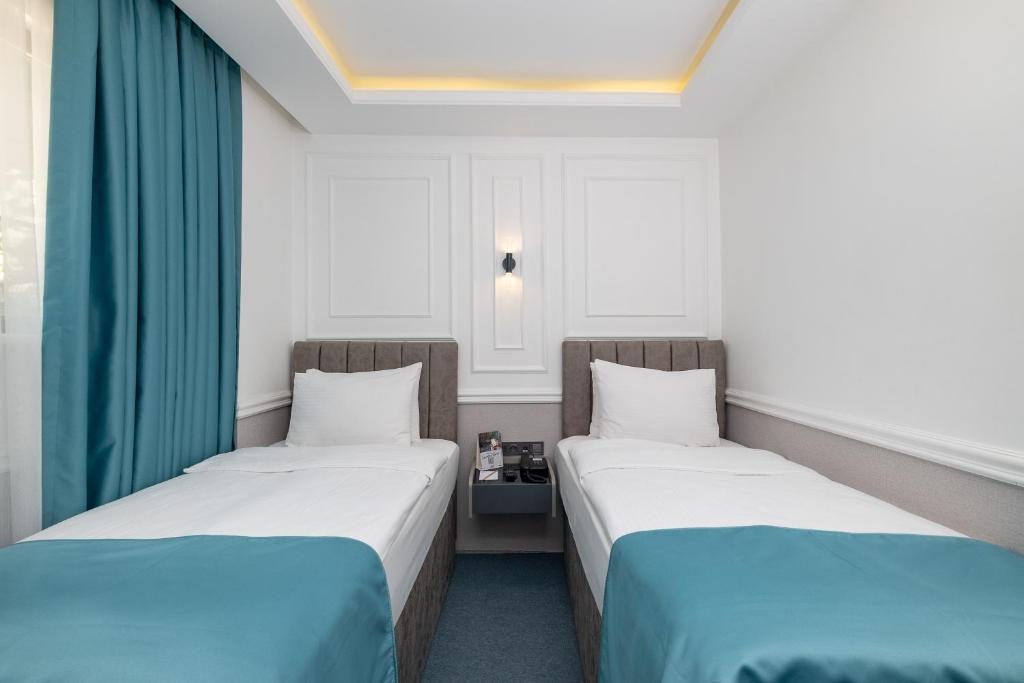 Postel nebo postele na pokoji v ubytování Askadar May Otel