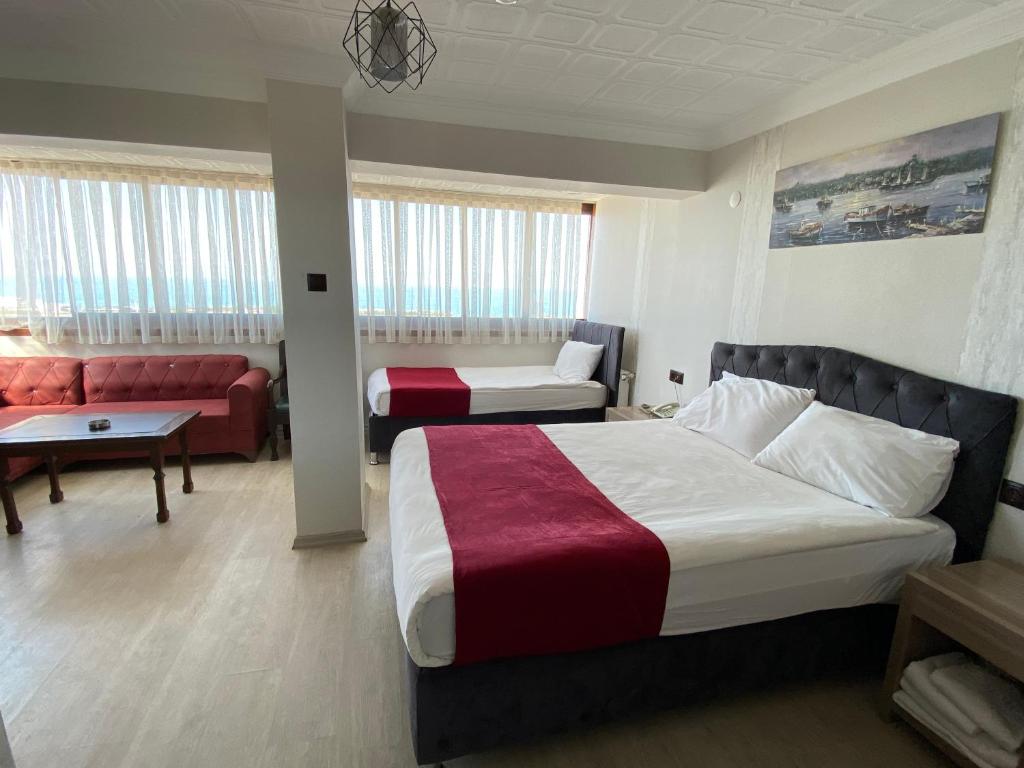 Postel nebo postele na pokoji v ubytování Elite Holiday Hotel
