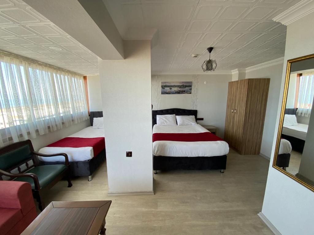 Postel nebo postele na pokoji v ubytování Elite Holiday Hotel