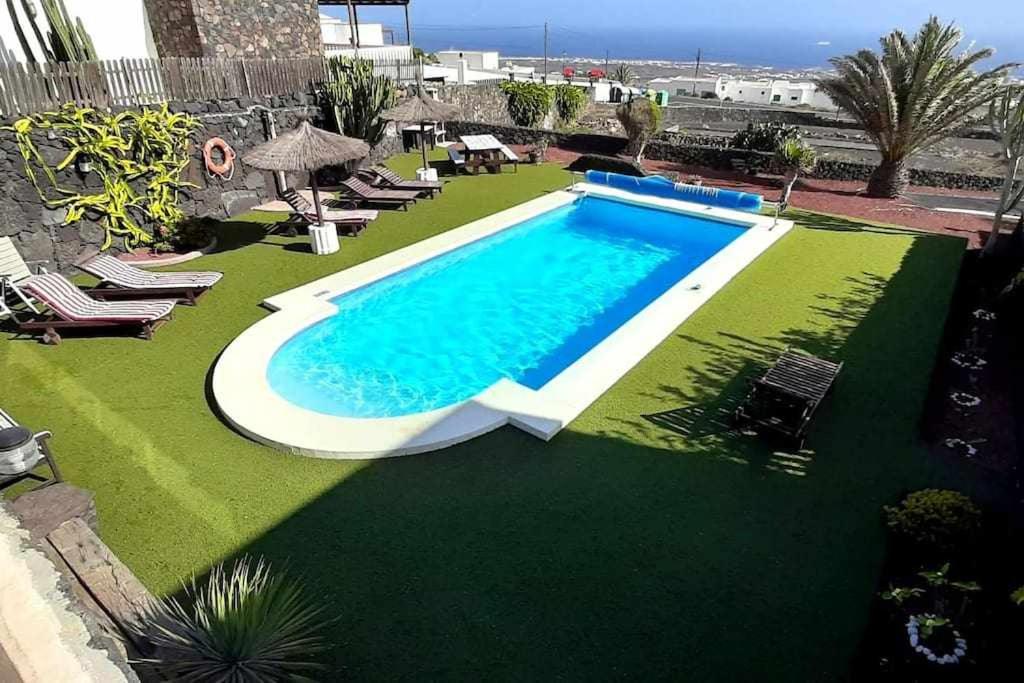 an image of a swimming pool in a yard at Casa Yuno en La Asomada in La Asomada