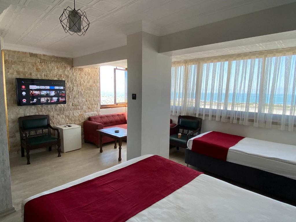 Postel nebo postele na pokoji v ubytování Elite Holiday Hotel
