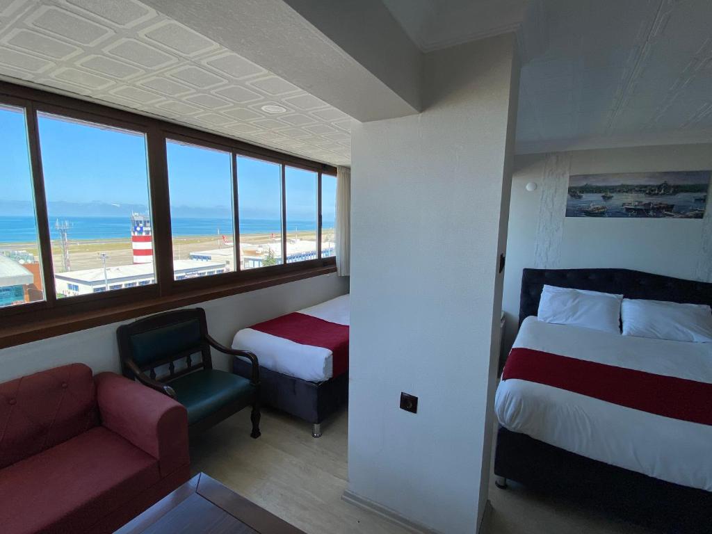 Postel nebo postele na pokoji v ubytování Elite Holiday Hotel