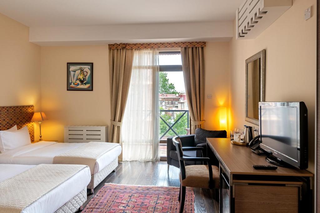 Postel nebo postele na pokoji v ubytování GINGER Hotel