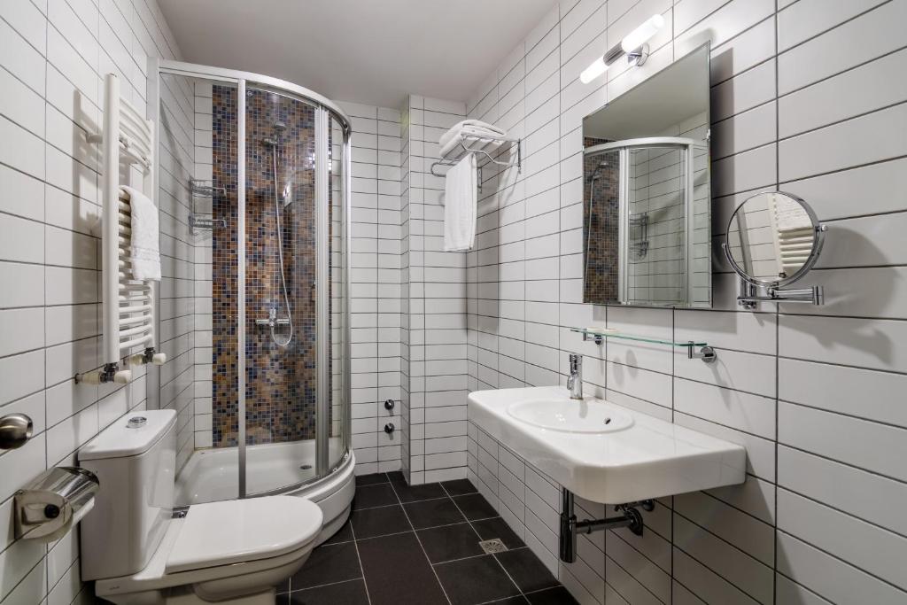 Koupelna v ubytování GINGER Hotel