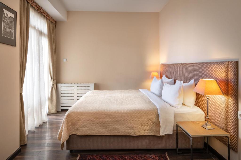Postel nebo postele na pokoji v ubytování GINGER Hotel