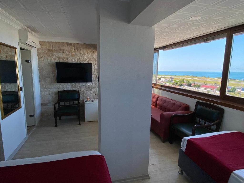 TV a/nebo společenská místnost v ubytování Elite Holiday Hotel