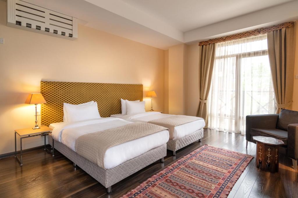 Postel nebo postele na pokoji v ubytování GINGER Hotel