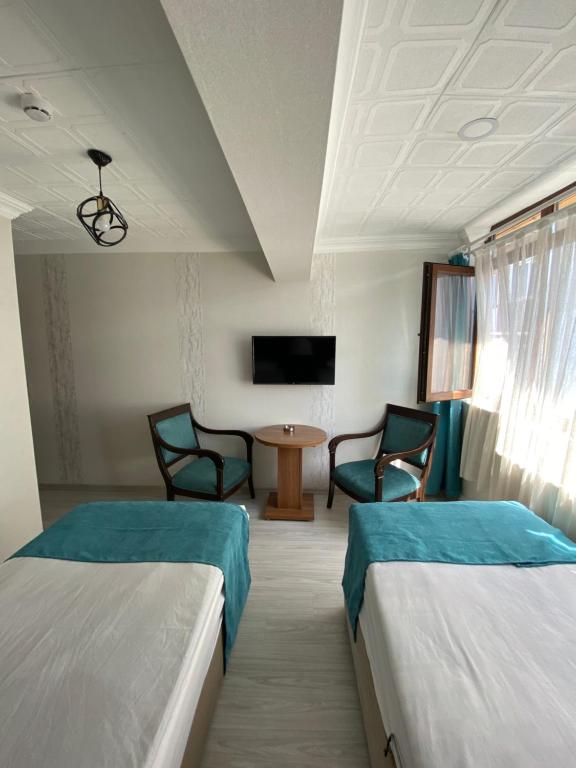 Postel nebo postele na pokoji v ubytování Elite Holiday Hotel