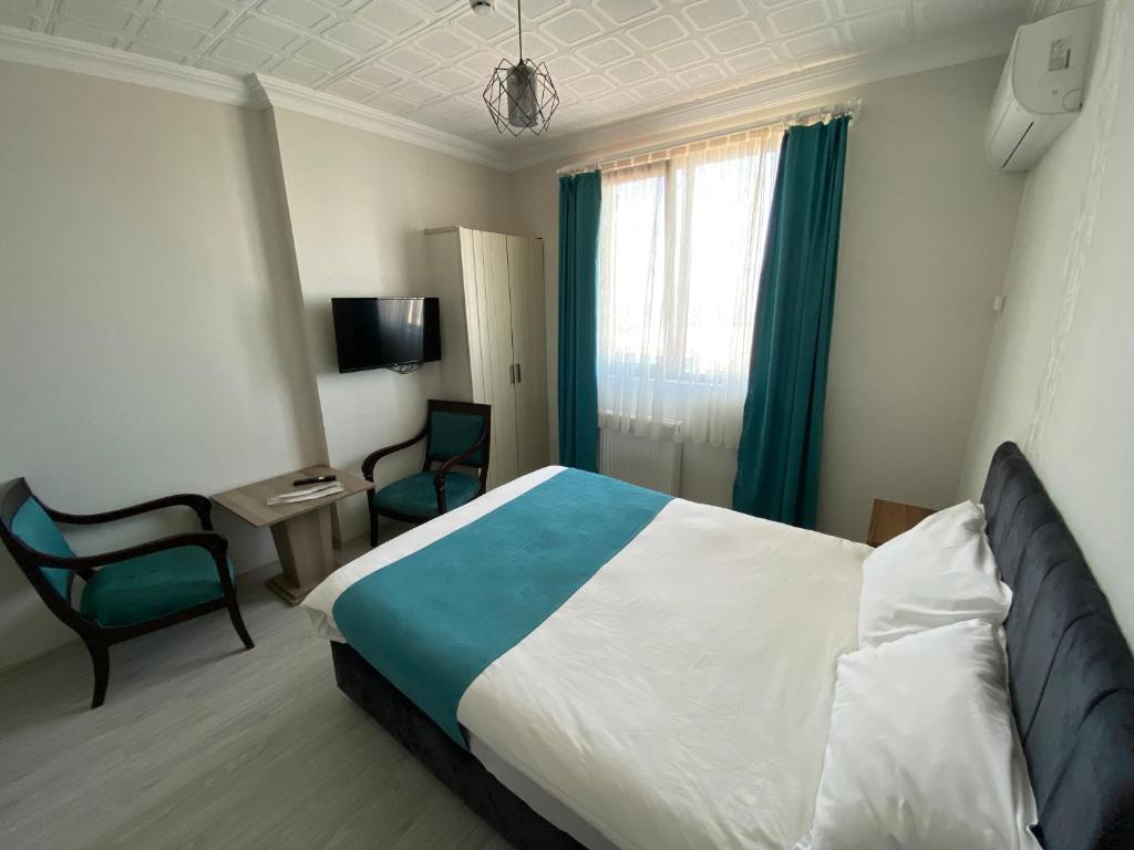 Postel nebo postele na pokoji v ubytování Elite Holiday Hotel