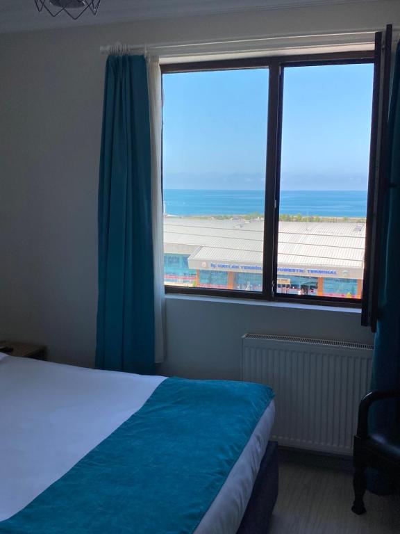 Postel nebo postele na pokoji v ubytování Elite Holiday Hotel
