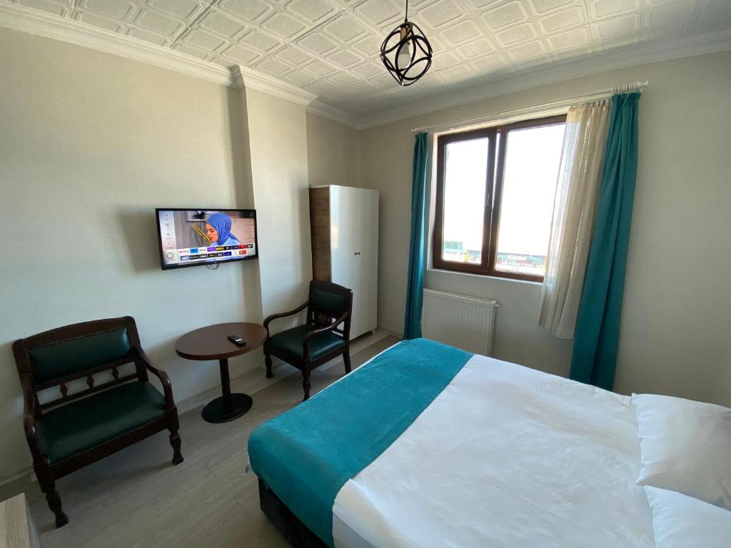 TV a/nebo společenská místnost v ubytování Elite Holiday Hotel