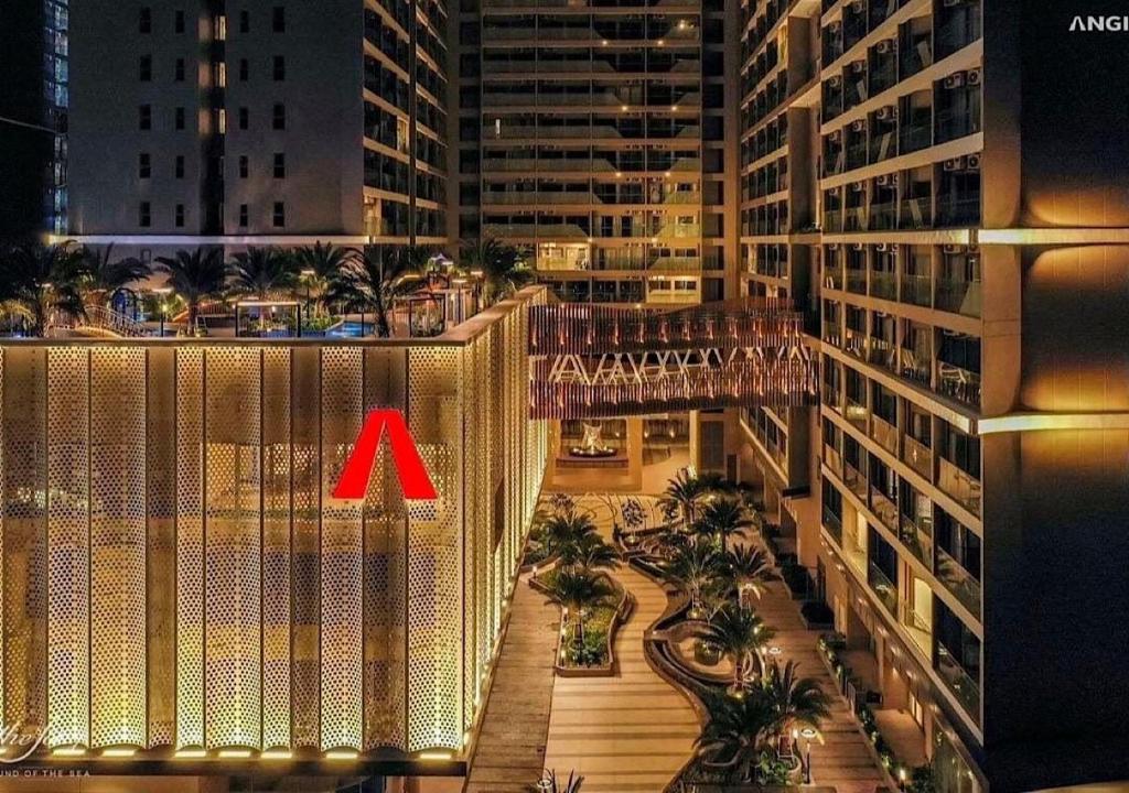 a view of a city at night with a red arrow at The Song Yuki Apartment in Vung Tau