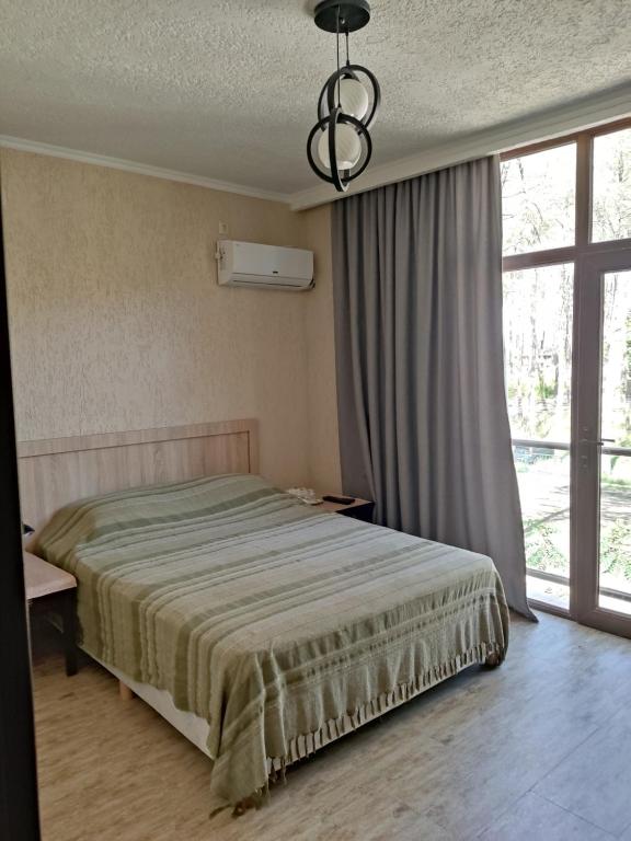 Postel nebo postele na pokoji v ubytování kaprovani Kako